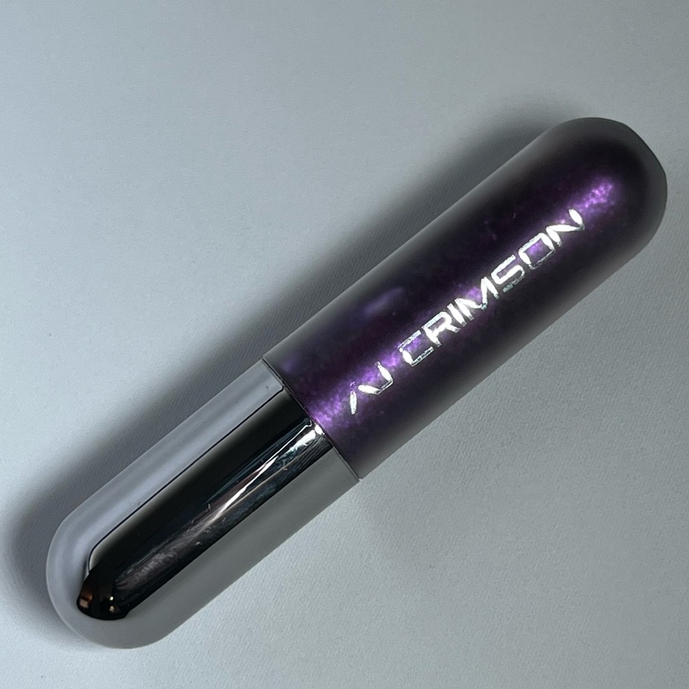 AJ Crimson Lip Gloss Shade: Go Off – Metallic Purple